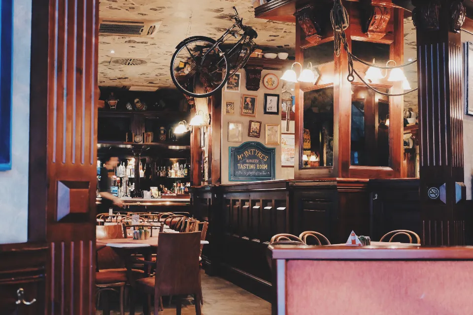 A wood-paneled neighborhood tavern dining room